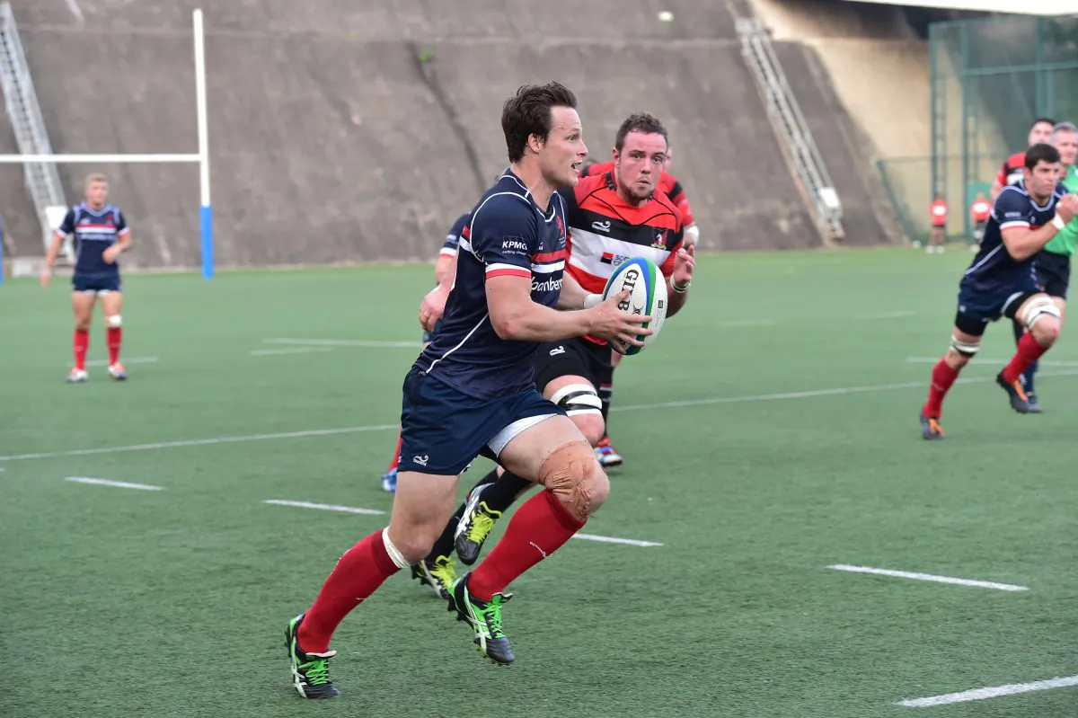 HK Scottish winger Bryan Rennie makes a break during their match against Societe Generale Valley in the HKFU Premiership match at Shek Kip Mei on Saturday Oct 18, 2014. (Bill Cox/Epoch Times)