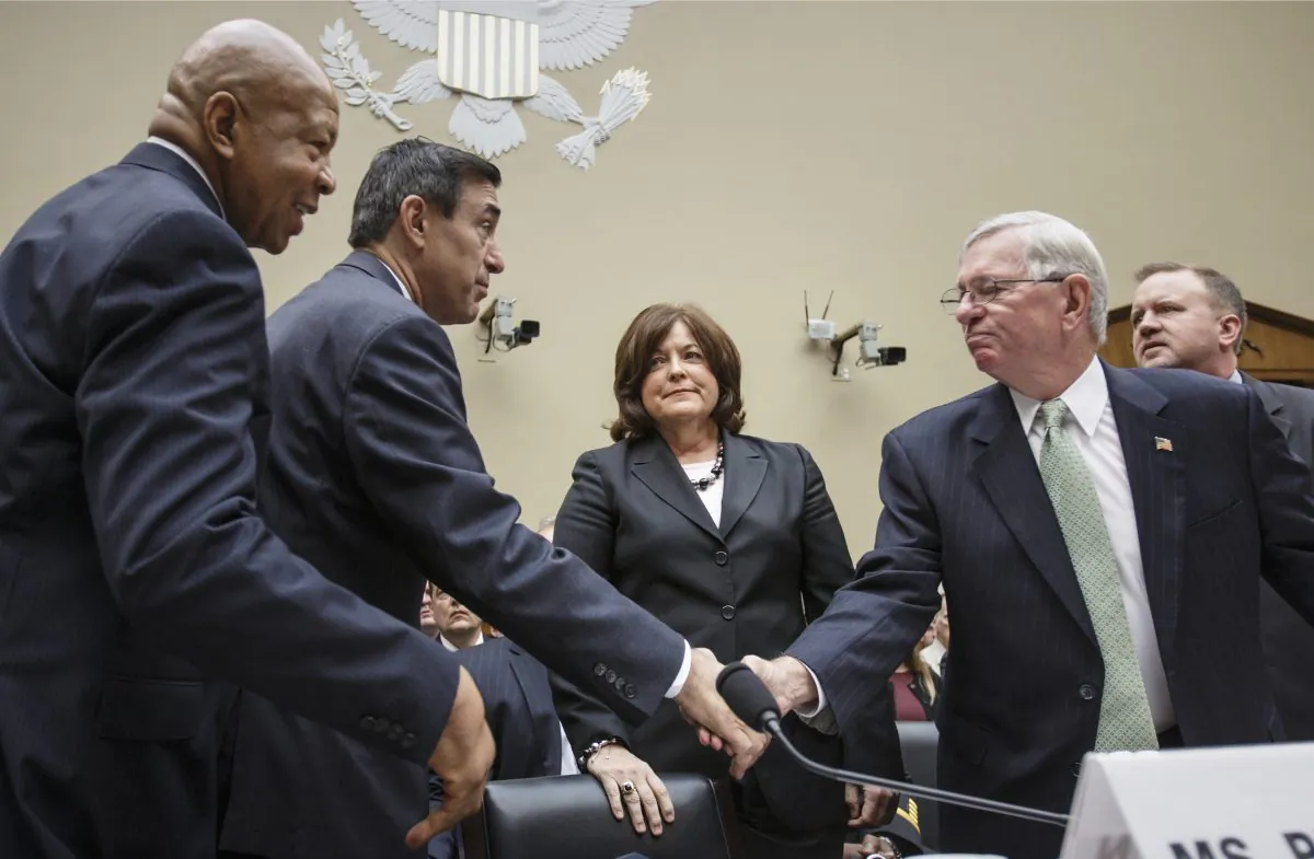 Secret Service Director Julia Pierson (C) is joined by (L-R) Rep. Elijah Cummings (D-Md.), House Oversight Committee Chairman Darrell Issa (R-Calif.), Ralph Basham, a former Secret Service director, and Todd M. Keil, senior advisor with a private security firm, at the start of a hearing to examine lapses in security around the president and the White House, on Capitol Hill in Washington, Sept. 30, 2014. Pierson, a 30 year veteran of the Secret Service, resigned Wednesday, Oct. 1, 2014, after calls for new leadership in the agency. (AP Photo/J. Scott Applewhite)