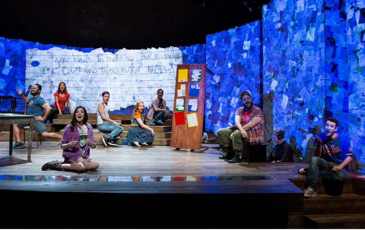The cast of “Found,” with part of a note projected on the set. (Kevin Thomas Garcia)