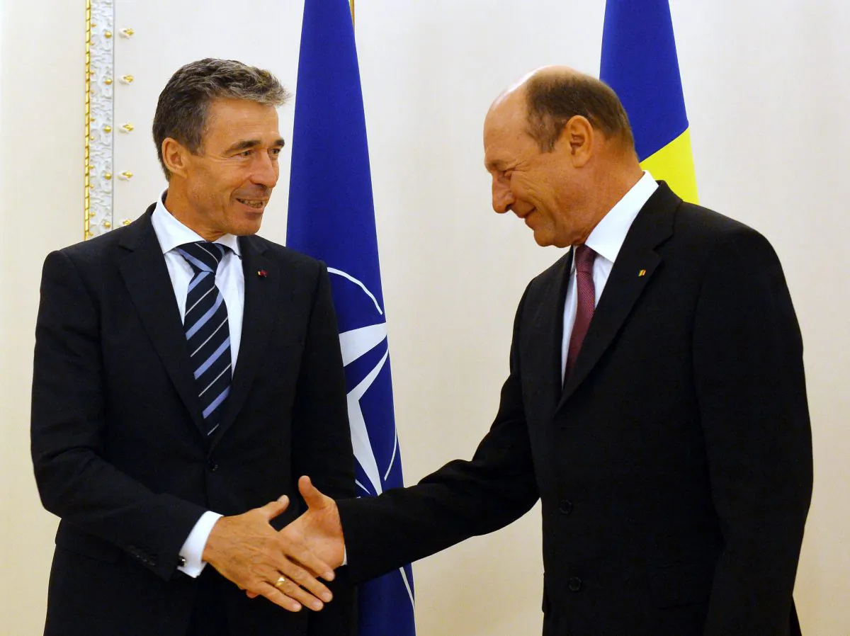 NATO Secretary General Anders Fogh Rasmussen (L) is welcomed by Romanian President Traian Basescu at the Cotroceni Palace, the Romanian Presidency headquarters in Bucharest, on May 24, 2013. (Daniel Mihailescu/AFP/Getty Images)
