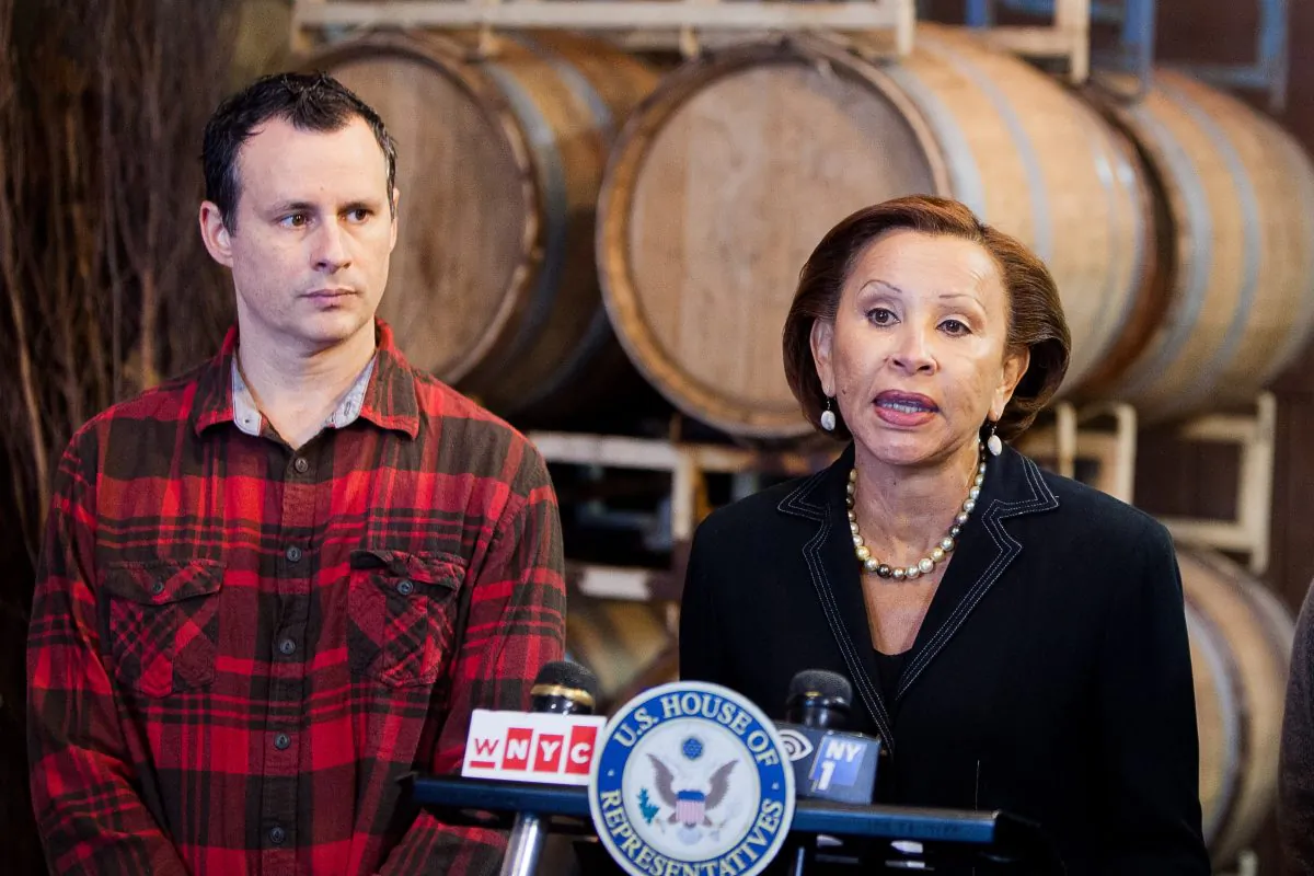 Mark Snyder, owner of the Red Hook Winery, and New York Congresswoman Nydia Velázquez criticize the Small Business Administration's response after Superstorm Sandy at Red Hook Winery in Brooklyn, N.Y., on Oct. 23, 2014. (Petr Svab/Epoch Times)