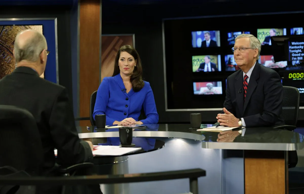 Senate Minority Leader Mitch McConnell of Ky. (R) and his Democratic Senate opponent, Kentucky Secretary of State Alison Lundergan Grimes, rehearsed with host Bill Goodman before their appearance on "Kentucky Tonight" television broadcast live from KET studios in Lexington, Ky., on Oct. 13, 2014. Struggling to preserve their Senate majority, Democrats are attacking Republicans over Medicare and Social Security in Louisiana, spending cuts in Arkansas, off-shore jobs in New Hampshire and women’s issues in Colorado. (AP Photo/The Lexington Herald-Leader, Pablo Alcala)
