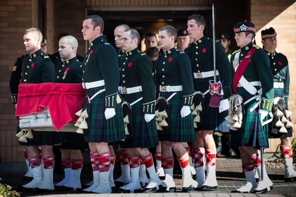 Canadian Army soldiers carry the casket carrying Cpl. Nathan Cirillo, two days after he was shot dead by a gunman while he guarded the National War Memorial, to a hearse during a precession from Ottawa to Cirillo's hometown of Hamilton, Ontario, on October 24, 2014 in Ottawa, Canada. After killing Cirillo the gunman stormed the main parliament building, terrorizing the public and politicians, before he was shot dead. (Andrew Burton/Getty Images)