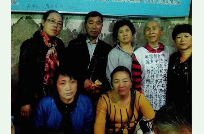 The picture of petitioners from Shandong, Heilongjiang, Liaoning and Jilin is taken at Number 37 Police Station in Beijing. (Picture from Human Rights Campaign in China website)