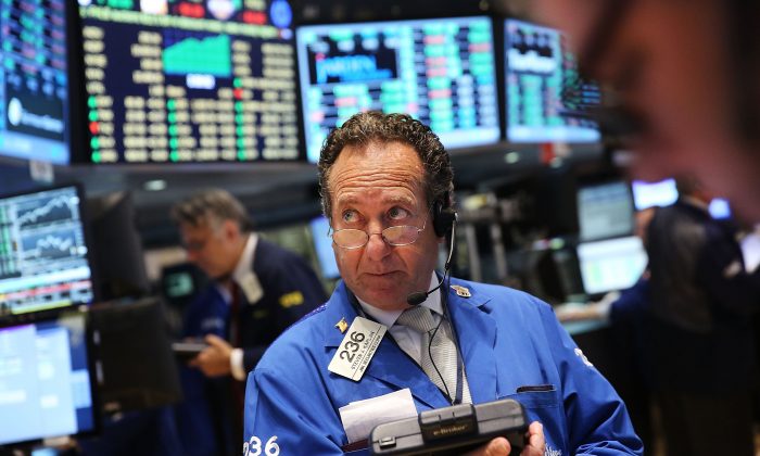 A trader works on the floor of the New York Stock Exchange (NYSE) on Oct. 21, 2014, in New York City. (Spencer Platt/Getty Images)