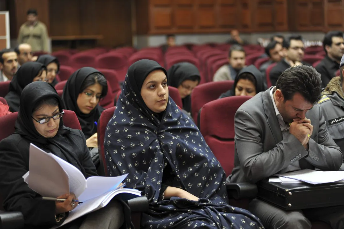Iranian Reyhaneh Jabbari (C) sits while attending her trial in a court in Tehran, Iran, on Dec. 15, 2008. Jabbari was hanged on Saturday, Oct. 25, 2014, who was convicted of murdering a man she said was trying to rape her, the official IRNA news agency reported. (AP Photo/Golara Sajjadian)