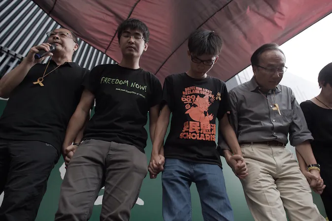 (L-R) Benny Tai of prominent pro-democracy group Occupy Central and Hong Kong student leaders Alex Chow, Joshua Wong and Alan Leong, of the Civic Party attend a press conference at the pro-democracy protesters camp site in the Admiralty district of Hong Kong on October 26, 2014. Hong Kong's pro-democracy protesters were on October 26 forced to suspend a planned vote on their next steps -- hours before it was due to begin -- due to differing opinions about how to move their month-long campaign forward. (Nicolas Asfouri/AFP/Getty Images)