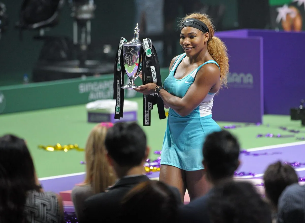 Serena Williams of the US poses with her trophy after defeating Simona Halep of Romania at the finals of the Women's Tennis Association (WTA) finals in Singapore on October 26, 2014. (MOHD FYROL/AFP/Getty Images)