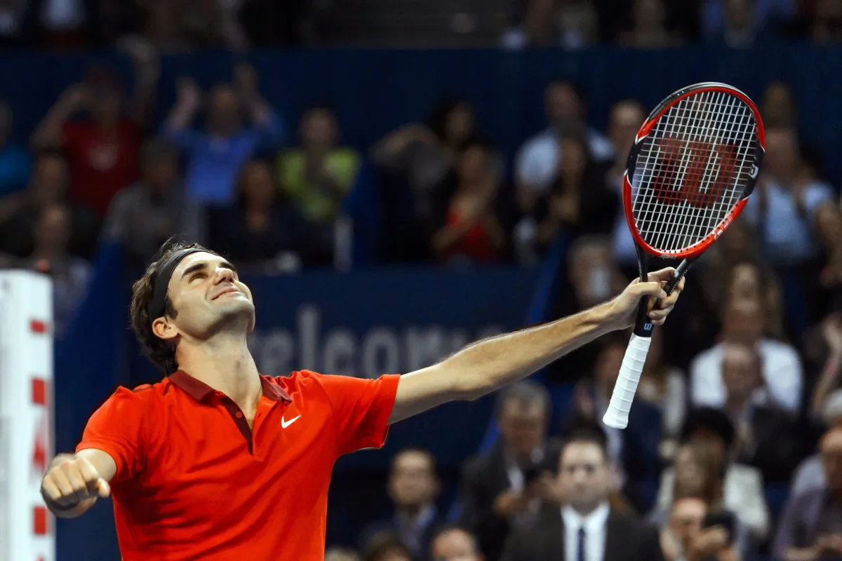 Roger Federer of Switzerland celebrates after he won his final against David Goffin of Belgium at the Swiss Indoors ATP tennis tournament on October 26, 2014 in Basel. (FABRICE COFFRINI/AFP/Getty Images)