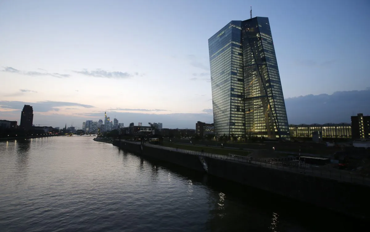 The new headquarters of the European Central Bank (ECB), building at right, under construction on the water front of the River Main in Frankfurt, Germany, on Sept. 24, 2014. (AP Photo/Michael Probst)
