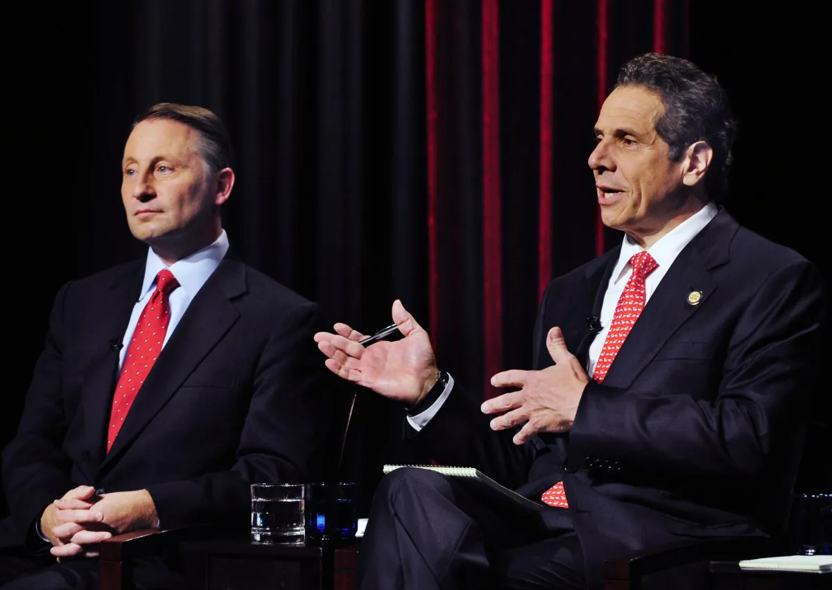 New York State Gubernatorial Candidate Republican candidate Rob Astorino (L) listens to the response of Democratic incumbent Andrew Cuomo, about fracking during a debate in Buffalo, N.Y., Wednesday, Oct. 22, 2014. (AP Photo/Gary Wiepert)
