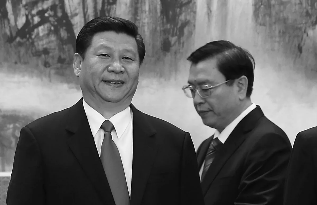 Politburo Standing Committee member Zhang Dejiang stands behind Xi Jinping, just after he was formally appointed to head the Chinese Communist Party, in the Great Hall of the People on Nov. 15, 2012 in Beijing. Hong Kong magazines have reported that Zhang was part of a plot to create chaos in Hong Kong in order to bring trouble to Xi. (Lintao Zhang/Getty Images)