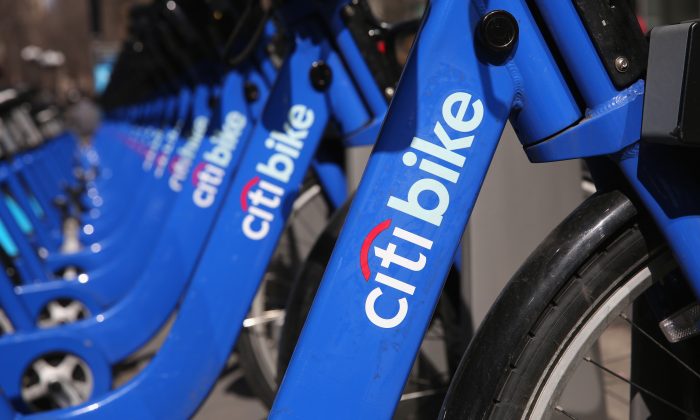 Citi Bikes await riders at a bicycle station in Manhattan, N.Y., March 21, 2014. The leaders of Citi Bike are trying to raise millions of dollars to keep the money-losing bike-share program in business, following a severe winter which greatly reduced bicycle usage in New York City. (John Moore/Getty Images)