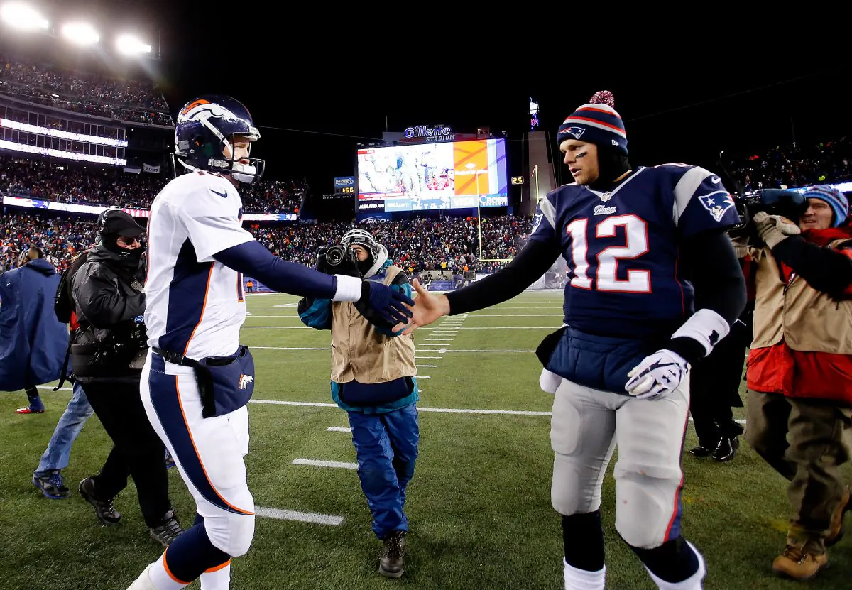 Peyton Manning (L) and Tom Brady shake hands after the New England Patriots defeated the Denver Broncos in overtime at Gillette Stadium on Nov. 24, 2013 in Foxborough, Mass. (Jim Rogash/Getty Images)