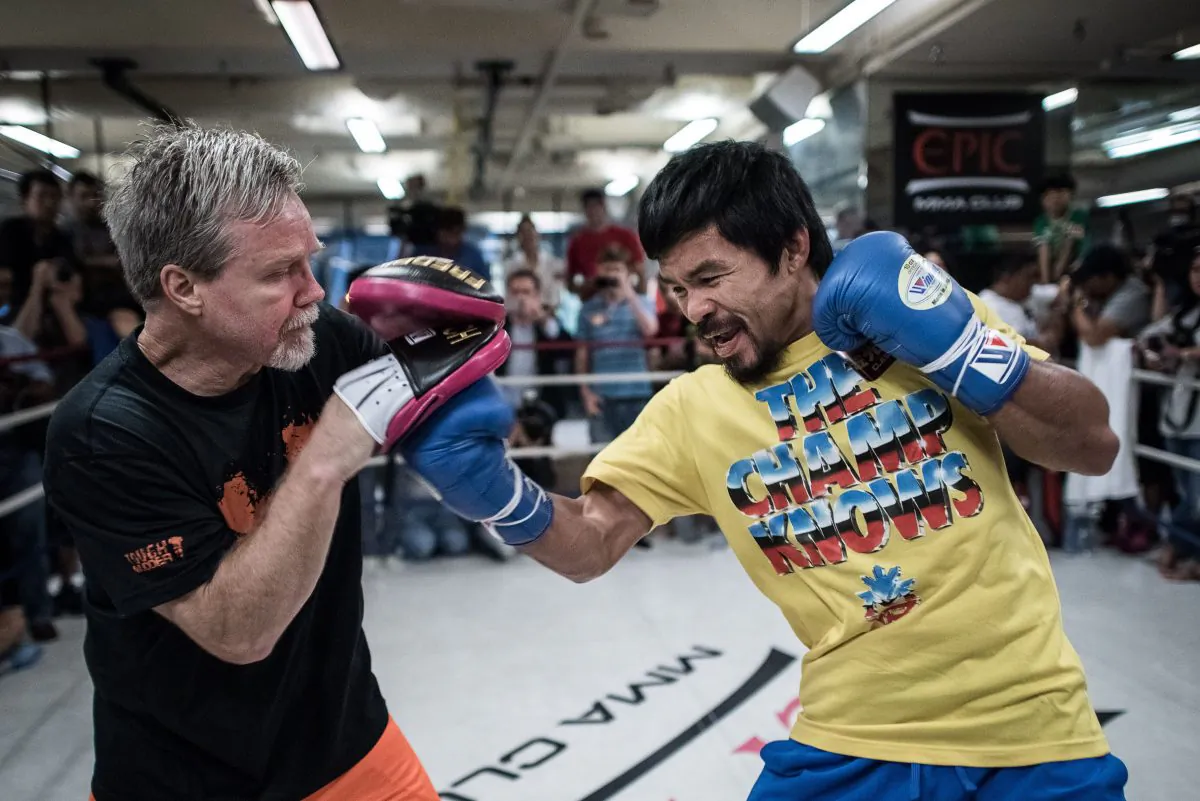 Philippine boxing icon Manny Pacquiao (R) takes part in a sparring session during a media call in Hong Kong on October 27, 2014. (AFP/Getty Images)