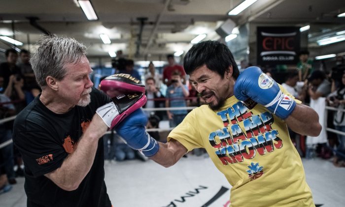 Philippine boxing icon Manny Pacquiao (R) takes part in a sparring session during a media call in Hong Kong on October 27, 2014. (AFP/Getty Images)