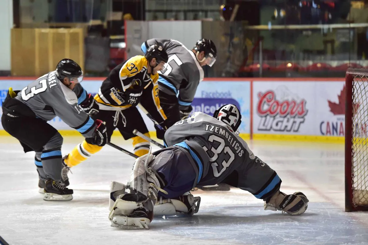 Leading goal scorer, Kory Falite of Hong Kong Tycoons torments the Shark’s defence during their HK CIHL match at Mega Ice on Saturday Oct 25, 2014. Tycoons came out on top 8-6 in this high scoring game. (Bill Cox/Epoch Times)