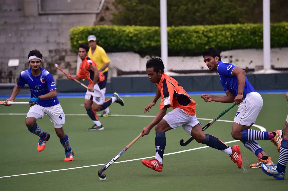 Fast action and an electric atmosphere throughout the game added to the pleasure for spectators at the HKHA Premier Division match between Punjab-A and SSSC-A at King’s Park on Saturday Oct 26, 2014. (Bill Cox/Epoch Times)