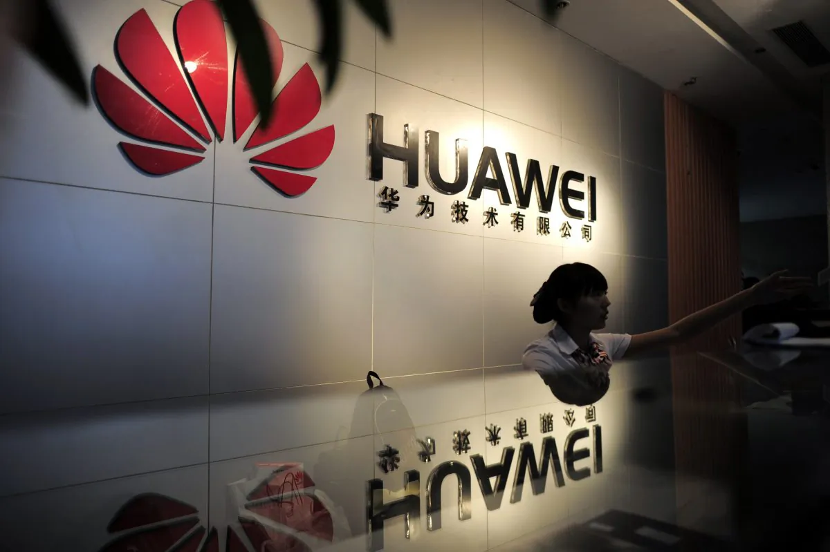 A receptionist at the office of Chinese telecommunications firm Huawei in Wuhan City, China on Oct. 8, 2012. (STR/AFP/Getty Images)
