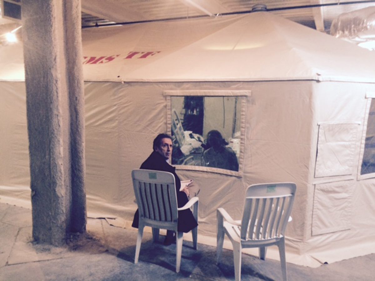 In this Oct. 26, 2014, photo, provided by attorney Steven Hyman, quarantined nurse Kaci Hickox meets with the prominent New York civil rights attorney Norman Siegel, seated, at the isolation tent at University Hospital in Newark, N.J., where Hickox was confined after flying into Newark Liberty International Airport following her work in West Africa caring for Ebola patients. For Americans wondering why President Barack Obama hasn’t forced all states to follow a single, national rule for isolating potential Ebola patients, the White House has a quick retort: Talk to the Founding Fathers. A hodgepodge of state policies, some of which directly contradict Obama’s recommendations, has sowed confusion about what’s really needed to stop Ebola from spreading in the United States. While public health advocates denounce state quarantines as draconian and scientifically baseless, anxious citizens in non-quarantine states are asking whether they’re at greater risk because their governors and the president have adopted a lesser level of caution. (AP Photo/Steven Hyman)