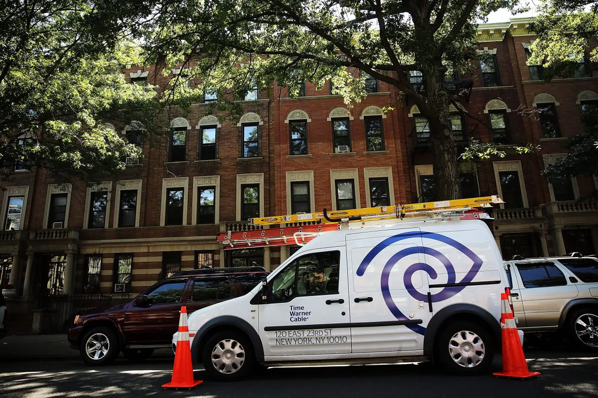 A Time Warner Cable truck in Brooklyn doing repairs on August 27, 2014 in New York City. Comcast is in the process of buying TWC is a $45 billion merger, which is undergoing review by state and federal agencies. (Spencer Platt/Getty Image)