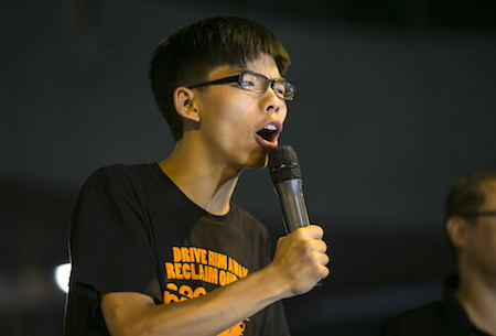 Student leader Joshua Wong speaks at a pro-democracy protest site outside the central government offices on October 19, 2014 in Hong Kong. (Paula Bronstein/Getty Images)