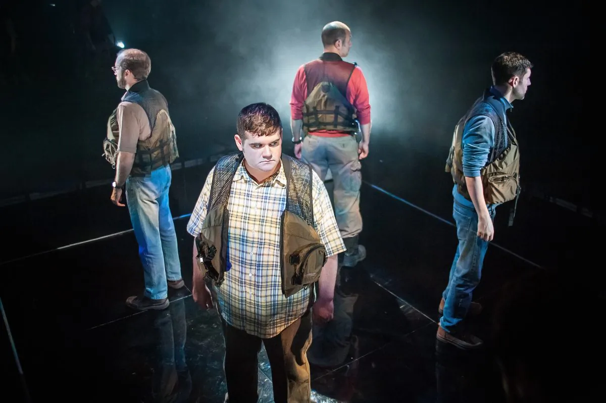 (Clockwise, starting center) Jarrod Zayas, Sean Tant, Gregory Konow, and Nick Paglino play four friends caught in a life and death situation in an adaptation of James Dickey’s “Deliverance.” (Jason Woodruff)