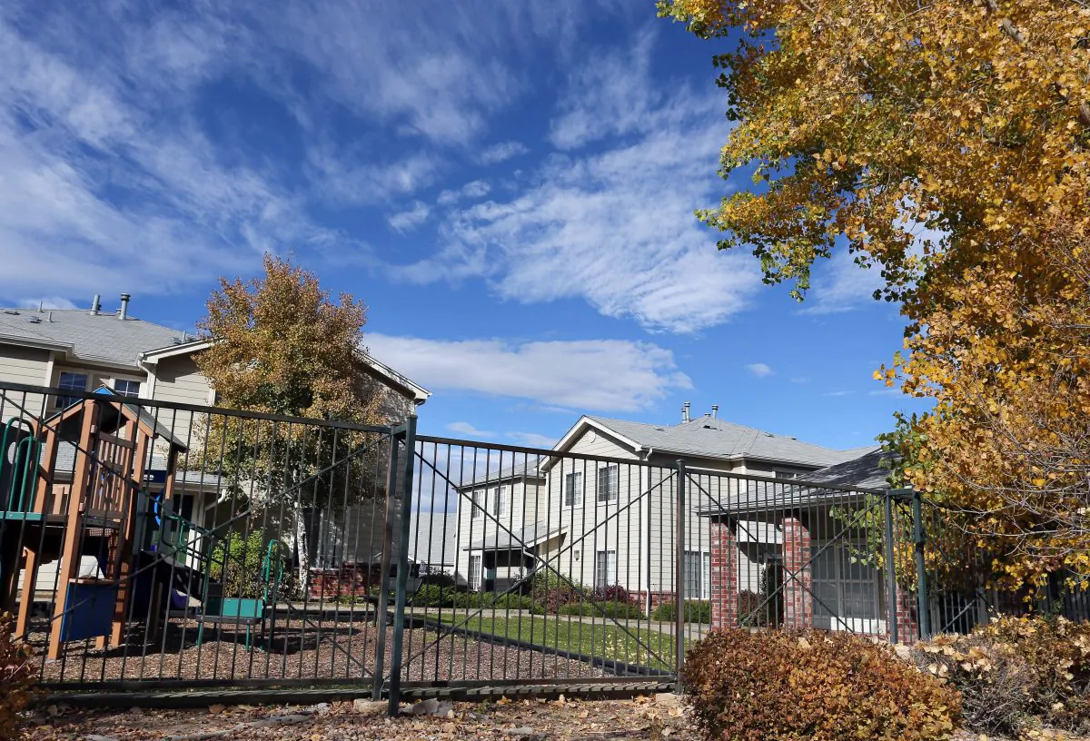 An apartment complex in Aurora, Colo., which police say is the home of one of the three teenage girls who, according to US authorities, were en route to join the Islamic State group in Syria when they were stopped at an airport in Germany. One of three suburban Denver girls who authorities say tried to join Islamic State militants in Syria was confused about what her role would be if she had actually made it there, the girl's father said Tuesday Oct. 28, 2014. (AP Photo/Brennan Linsley)
