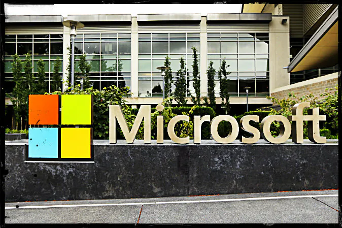 This photo taken July 3, 2014 shows the Microsoft Corp. logo outside the Microsoft Visitor Center in Redmond, Wash. (Ted S. Warren/AP Photo; effects added by Epoch times)