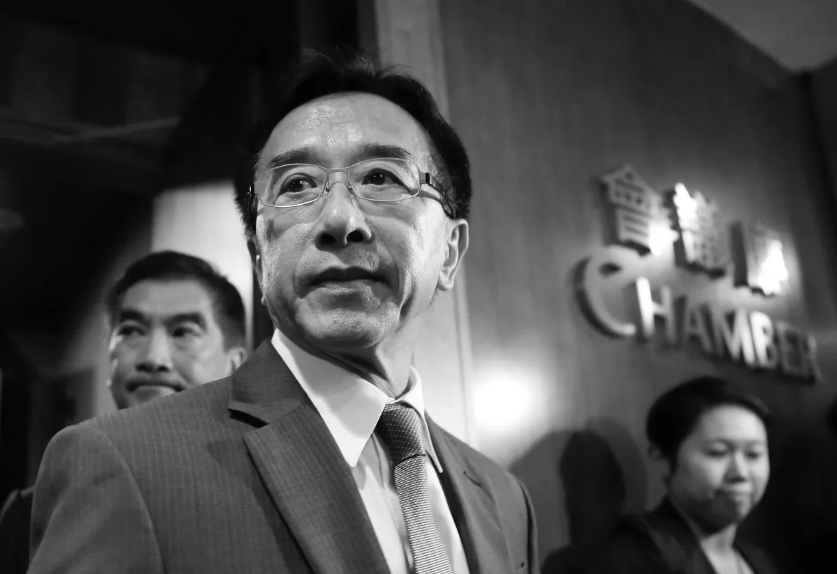 Hong Kong tycoon, chairman of Liberal Party James Tien walks out from Legislative Council chamber in Hong Kong's Admiralty, Wednesday, Oct. 29, 2014. Delegates to China's top government advisory body voted Wednesday to kick James Tien out after his comments on the unpopular Hong Kong leader Leung Chun-ying. (AP Photo/Kin Cheung)