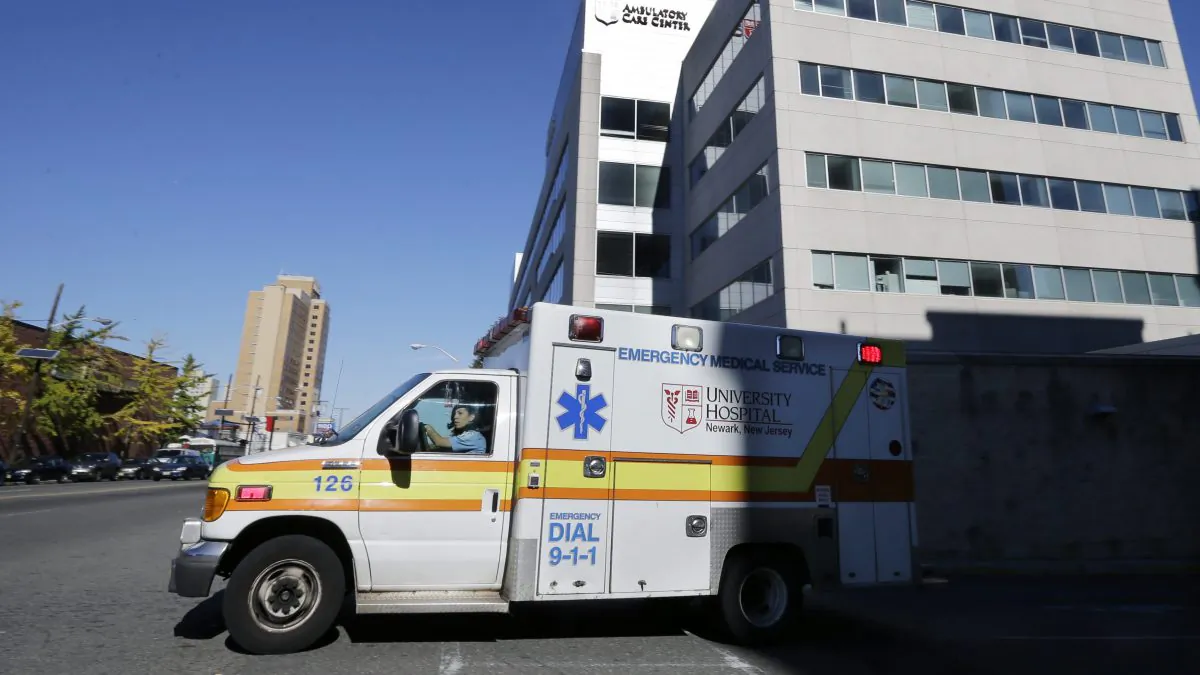 An ambulance drives near University Hospital of Newark in Newark, N.J. on Oct. 27, 2014. (Mel Evans/AP Photo)