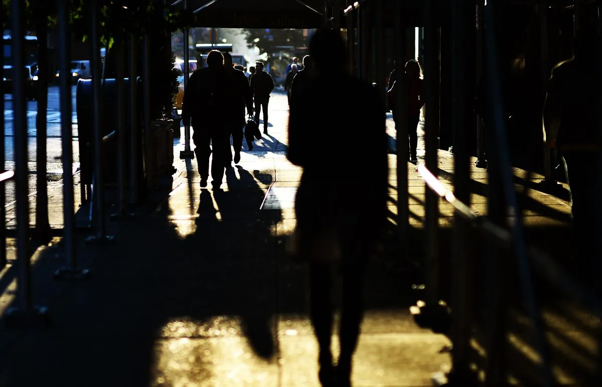 People make their way through a scaffolding over a footpath in New York on Oct. 30, 2014. (Jewel Samad/AFP/Getty Images)