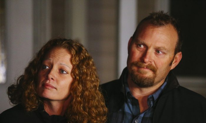 Kaci Hickox, a nurse who treated Ebola patients in West Africa (L) and boyfriend Ted Wilbur take questions from the media outside her home in Fort Kent, Maine, on Wednesday, Oct. 29, 2014. Hickox, the first person forced into New Jersey's mandatory quarantine for people arriving at the Newark airport from three West African countries, vowed to defy Maine's voluntary quarantine. (AP Photo/Portland Press Herald, Whitney Hayward)