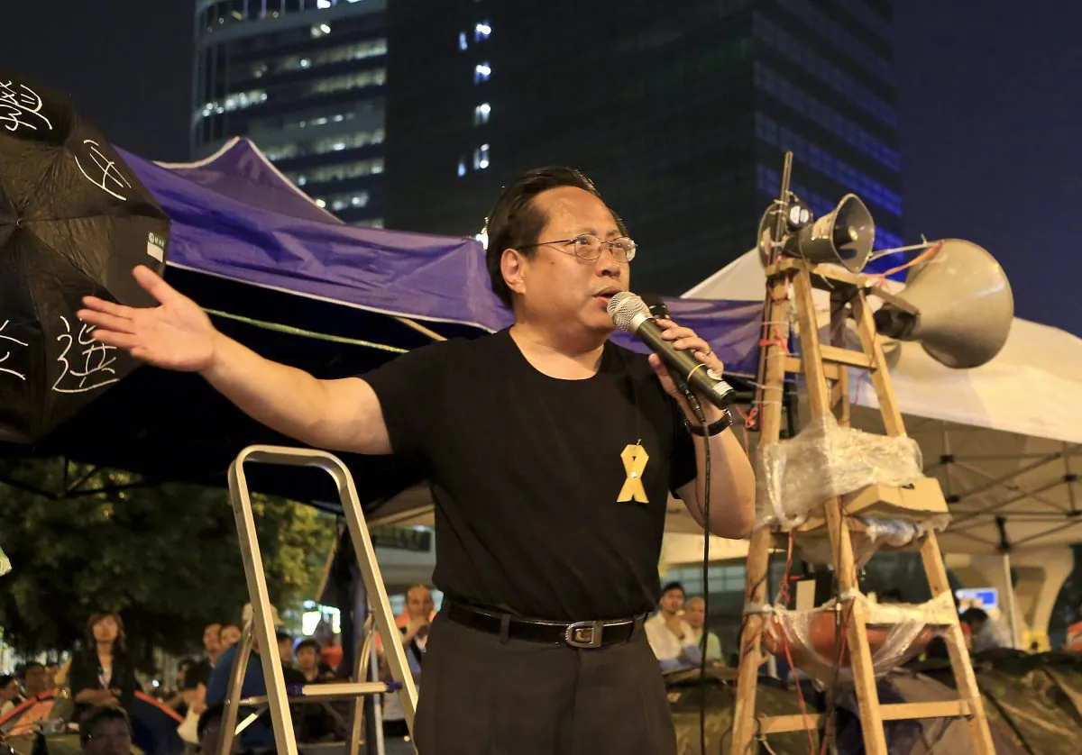 Albert Ho, speaking through a megaphone at the Admiralty occupied zone protest site on Oct. 14. The pan democrats, like Ho, have largely been on the sidelines supporting the student-led umbrella movement. (Yu Kong/Epoch Times)