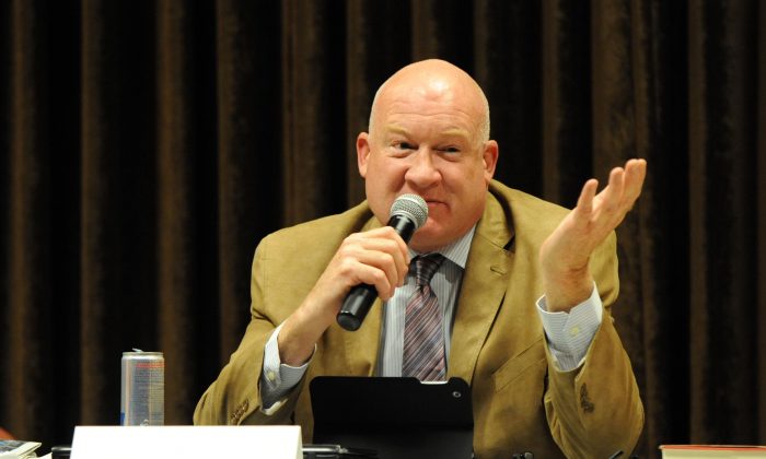 “The Slaughter” author Ethan Gutmann speaks during a forum in Calgary, Canada, on Oct. 29, 2014. (Jerry Wu/Epoch Times)