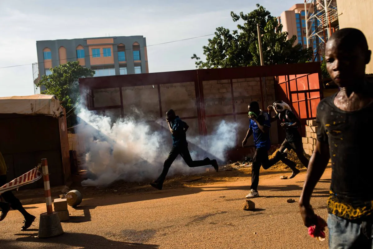Protestors on the rampage near the  parliament building in Burkina Faso as people protest  against their longtime president Blaise Compaore  who seeks another term in Ouagadougou, Burkina Faso, Thursday, Oct. 30, 2014. Protesters stormed Burkina Faso’s parliament Thursday, dragging furniture and computers onto the street and setting the main chamber ablaze, in the most significant challenge to the president’s rule during his 27 years in power.(AP Photo/Theo Renaut)