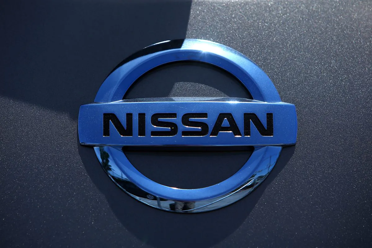 The Nissan logo is displayed on a brand new Nissan car at Nissan Marin in San Rafael, Calif., on May 1, 2014. (Justin Sullivan/Getty Images)