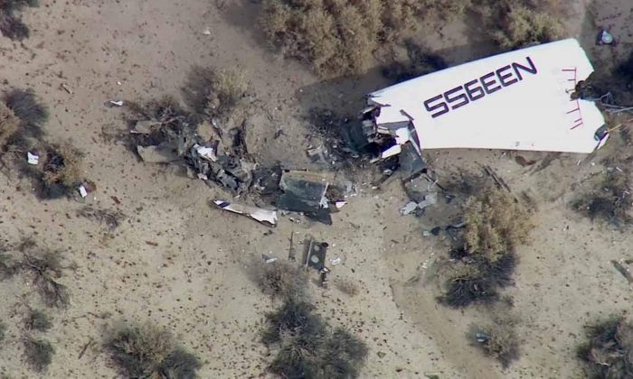 This image from video by KABC TV Los Angeles shows wreckage of what is believed to be SpaceShipTwo in Southern California's Mojave Desert on Friday, Oct. 31, 2014. A Virgin Galactic space tourism rocket exploded after taking off on a test flight, a witness said Friday. (AP Photo/KABC TV)