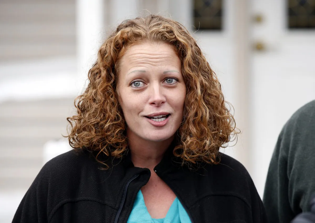 Nurse Kaci Hickox speaks to reporters outside their home, Friday, Oct. 31, 2014, in Fort Kent, Maine. A Maine judge gave Hickox the OK to go wherever she pleases, handing state officials a defeat Friday in their bid to restrict her movements as a precaution against Ebola. (AP Photo/Robert F. Bukaty)