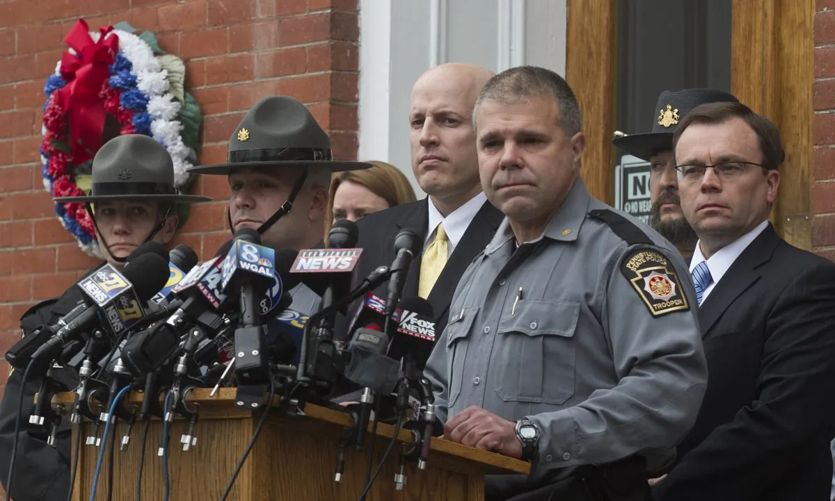 Pennsylvania State Police Lt. Col. George Bivens speaks during a news conference in front of the Pike County Courthouse on Friday, Oct. 31, 2014 in Milford, Pa. following a hearing for accused killer Matthew Frein. (AP Photo/The Scranton Times-Tribune, Michael J. Mullen)