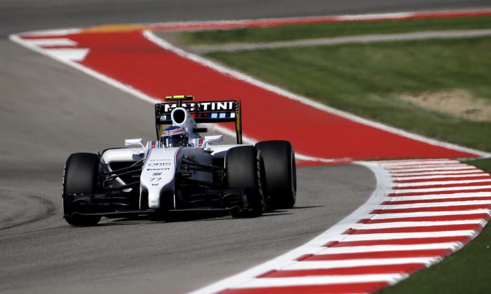 Williams driver Valtteri Bottas, of Finland, drives through the course during qualifying for the Formula One U.S. Grand Prix auto race at the Circuit of the Americas, Saturday, Nov. 1, 2014, in Austin, Texas. (AP Photo/David J. Phillip)