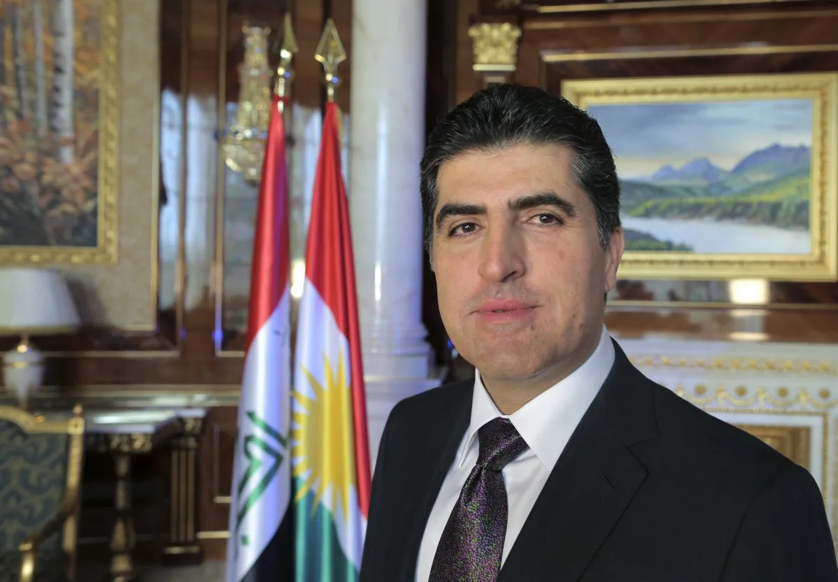 Nechervan Barzani, prime minister of Iraq's semi-autonomous Kurdish region, poses for a photo during an interview with The Associated Press in Irbil, Iraq, Sunday, Nov. 2, 2014. Barzani said Iraqi Kurdish forces will only stay in Syria "temporarily" as they seek to help defend the city of Kobani from militants with the Islamic State group. (AP Photo/Bram Janssen)