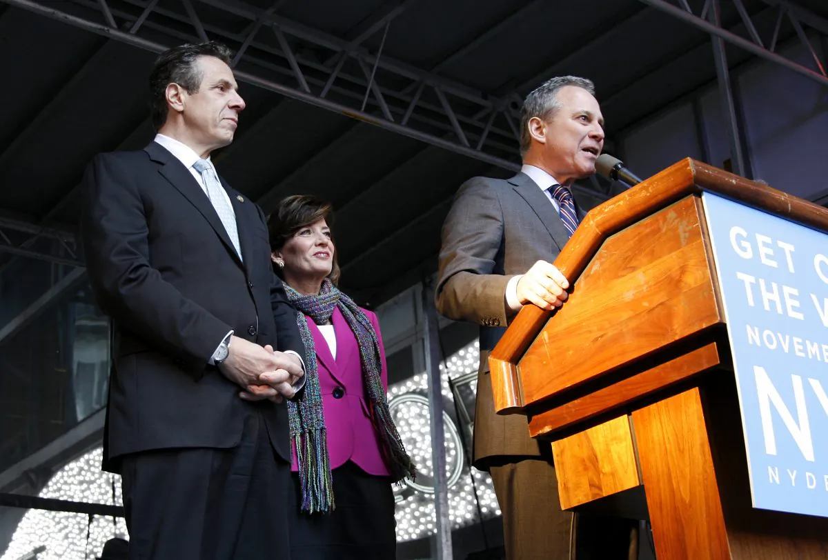 New York Gov. Andrew Cuomo, his running mate Kathy Hochul, and Attorney General Eric Schneiderman at a rally on the eve of the mid-term elections, in Times Square, New York, on Nov. 3, 2014. (Shannon Liao/Epoch Times)