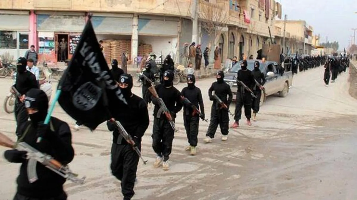 This undated file image posted on a militant website on Jan. 14, 2014, which has been verified and is consistent with other AP reporting, shows fighters from the al-Qaida linked Islamic State of Iraq and the Levant (ISIL) marching in Raqqa, Syria. U.S. Arab allies Egypt, Saudi Arabia, the United Arab Emirates and Kuwait are discussing creation of a military pact to take on Islamic militants, with the possibility of a joint force to intervene around the Middle East, The Associated Press has learned in Nov. 2014. Even if no joint force is agreed on, the alliance would coordinate military action, aiming at quick, pinpoint operations against militants rather than longer missions, officials said. (AP Photo/Militant Website, File)