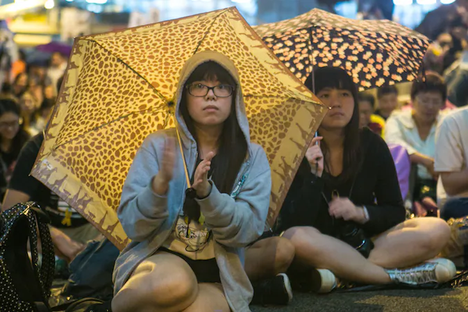Pro-democracy protesters attend a rally marking one month of protests at the Central District in Hong Kong on Oct. 28, 2014. (Benjamin Chasteen/Epoch Times)