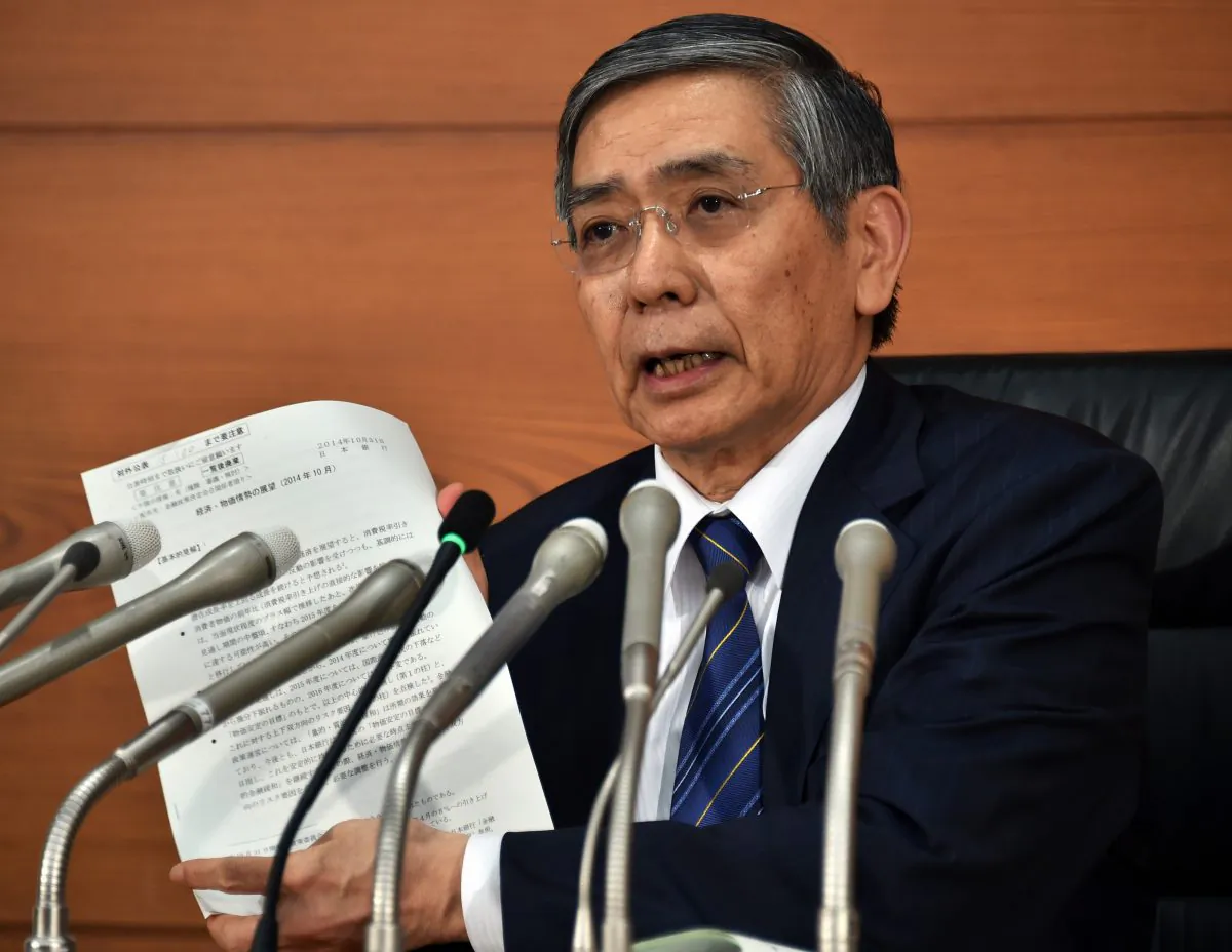 Bank of Japan governor Haruhiko Kuroda speaks to the press in Tokyo on Oct. 31, 2014. The Bank of Japan ramped up its vast monetary easing programme following a string of poor data that has fanned fears the economy may contract again in the third quarter. (Yoshikazu Tsuno/AFP/Getty Images)