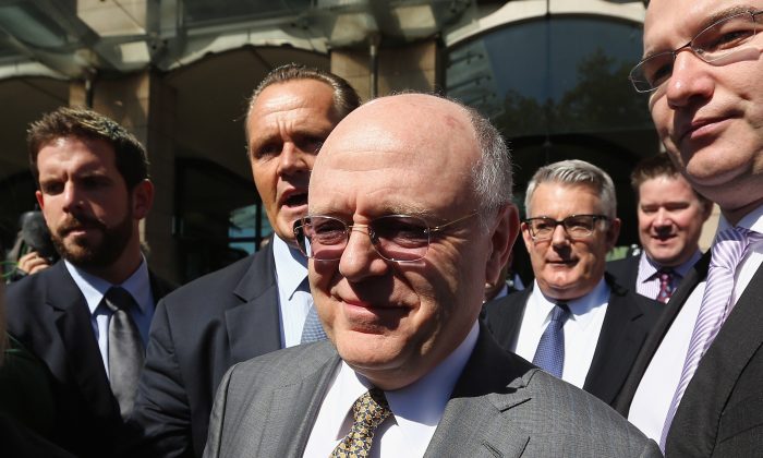 Ian Read, chief executive of Pfizer, leaves the House of Commons in London on May 14, 2014. Read gave evidence in relation to Pfizer's 63 billion pound takeover bid for British rival AstraZeneca. (Dan Kitwood/Getty Images)