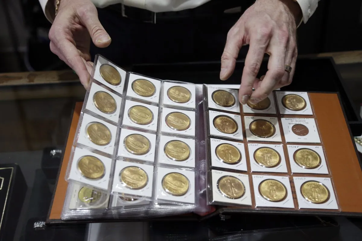 Numis International Inc. owner Jacob Notowitz displays antique gold coins at his store in Millbrae, Calif., on Nov. 5, 2014 . (Marcio Jose Sanchez/AP)