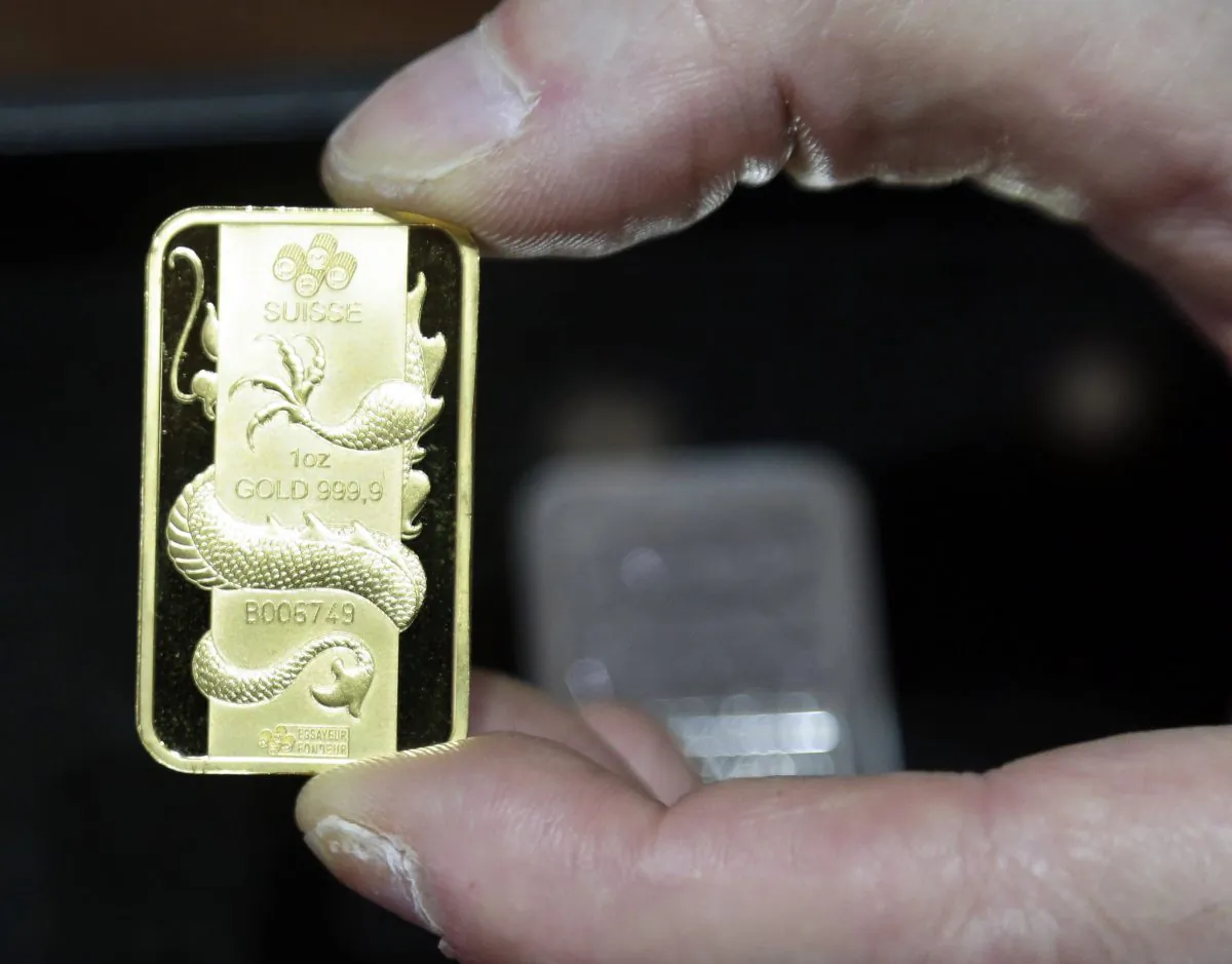A Swiss gold coin at Numis International Inc. in Millbrae, Calif., Nov. 5, 2014 .  (AP Photo/Marcio Jose Sanchez)