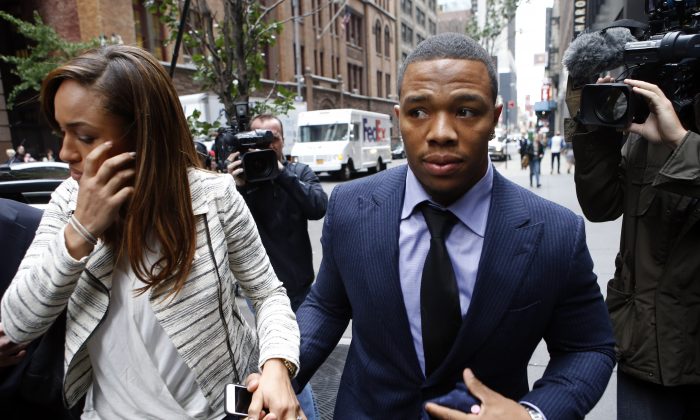 Ray Rice will not sign with the Denver Broncos, but a satirical website is saying otherwise. Ray Rice arrives with his wife Janay Palmer for an appeal hearing of his indefinite suspension from the NFL, Wednesday, Nov. 5, 2014, in New York. (AP Photo/Jason DeCrow)